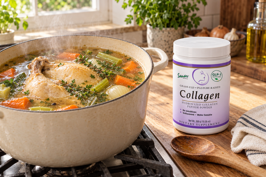 Pot of homemade caldo bone broth next to Sanar Naturals Collagen Peptides Powder on a kitchen counter