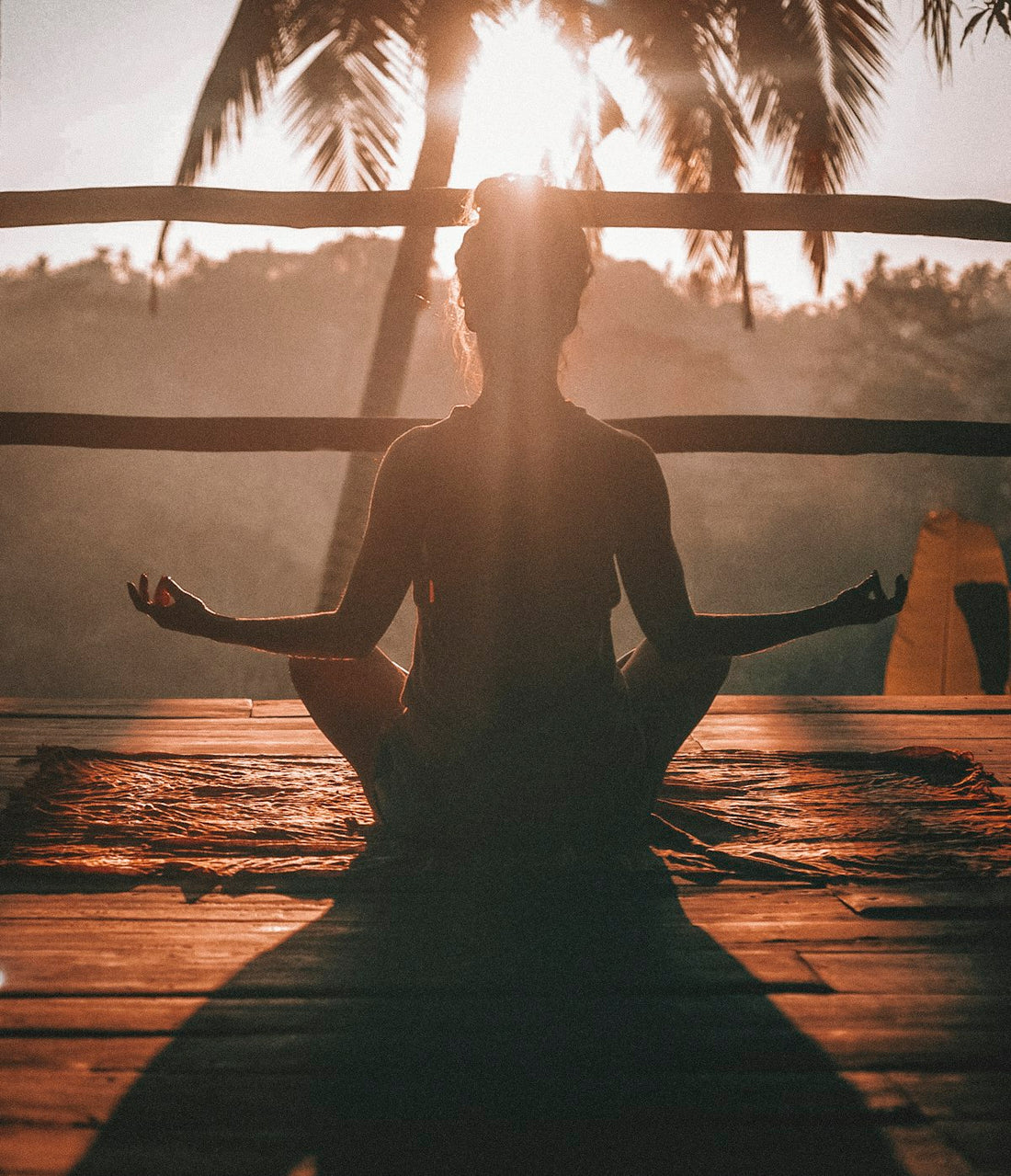 Person meditating peacefully outdoors for stress relief and calm